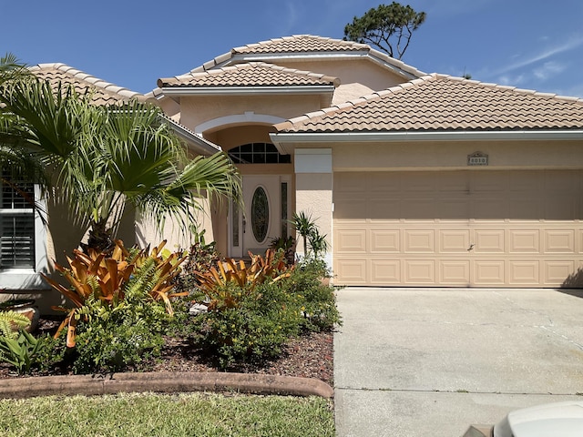 mediterranean / spanish-style home featuring a garage