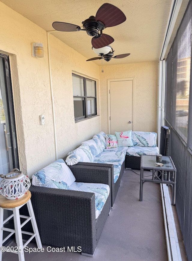 exterior space with ceiling fan and outdoor lounge area