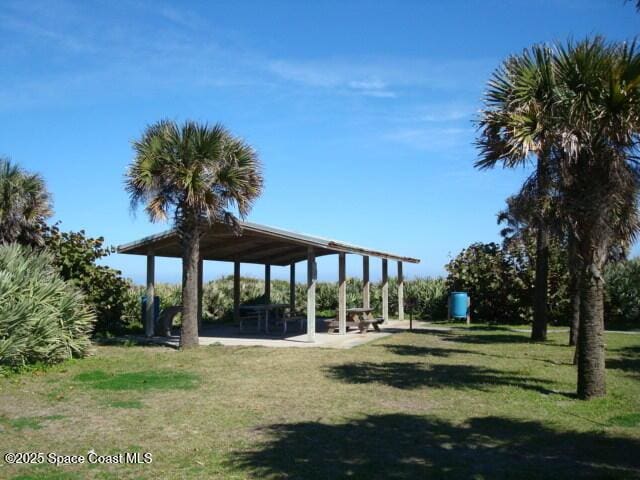 view of property's community with a gazebo and a lawn