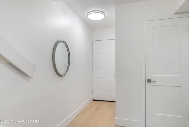 hall with light wood-type flooring