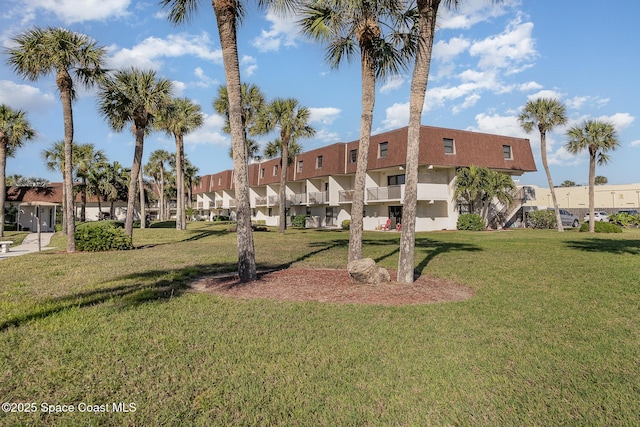 view of home's community with a lawn