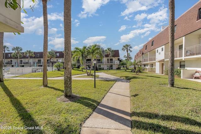 view of home's community featuring a yard