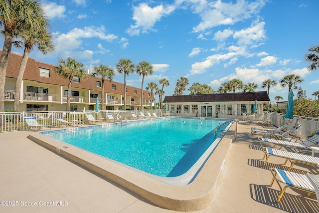 view of swimming pool with a patio