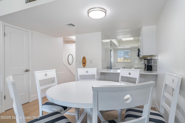 dining space featuring light hardwood / wood-style flooring