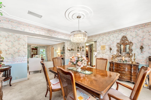 dining space with light colored carpet, crown molding, and a notable chandelier