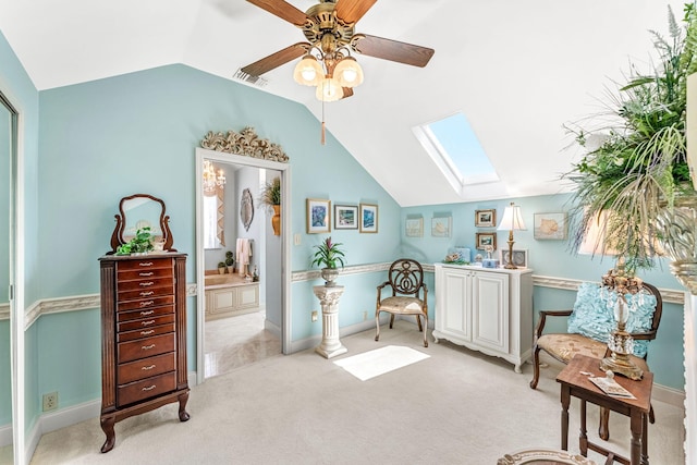 living area featuring ceiling fan, light colored carpet, and lofted ceiling