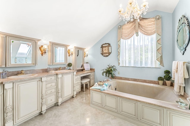 bathroom with tile patterned floors, vanity, a chandelier, lofted ceiling, and a bathing tub