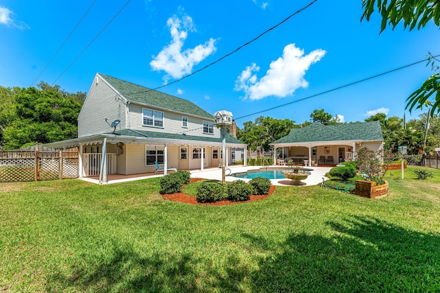 back of house featuring a yard and a patio