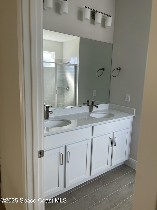 bathroom with vanity and an enclosed shower