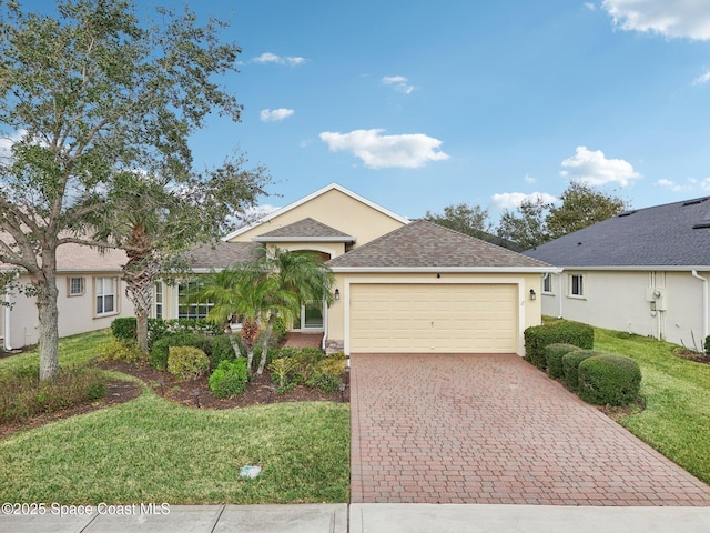 ranch-style house featuring a front lawn and a garage