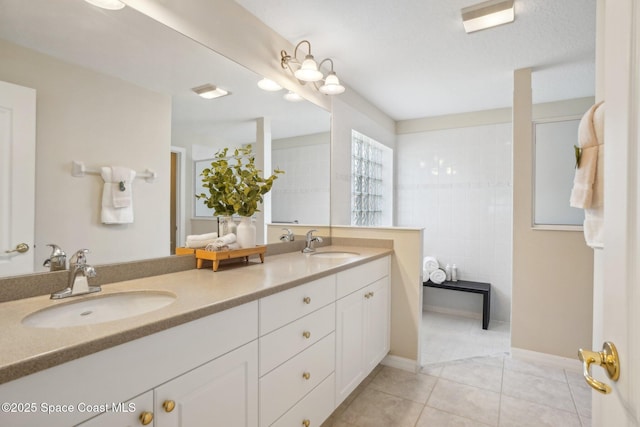 bathroom with tile patterned floors and vanity