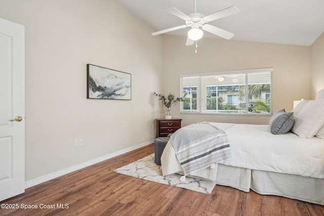 bedroom with wood-type flooring, ceiling fan, and lofted ceiling