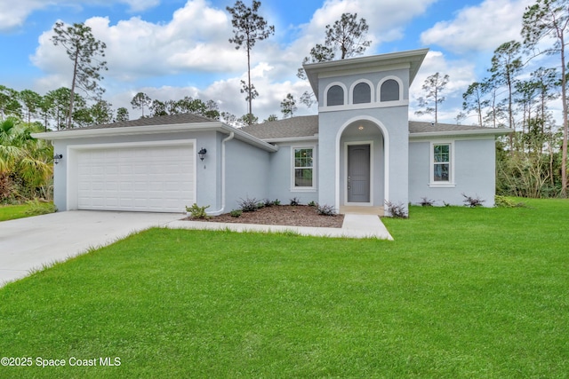 view of front of house featuring a front yard and a garage