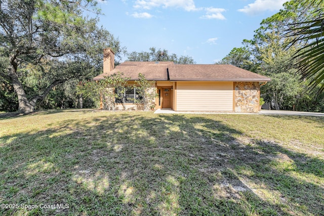 single story home with a front lawn