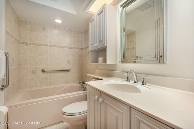 full bathroom with tiled shower / bath, vanity, and toilet