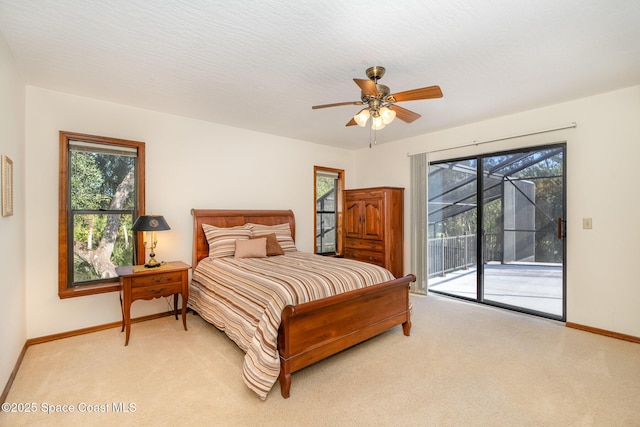 carpeted bedroom featuring ceiling fan, access to outside, and multiple windows