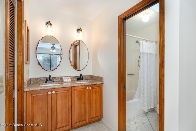 bathroom with tile patterned flooring, shower / tub combo, and vanity