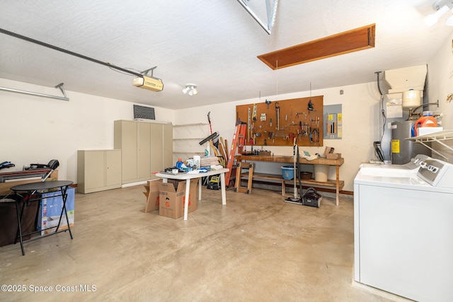 garage with a workshop area, water heater, washing machine and dryer, electric panel, and a garage door opener