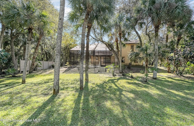 view of yard with a lanai