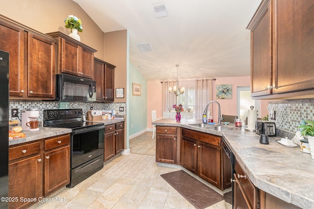 kitchen with decorative backsplash, vaulted ceiling, sink, black appliances, and a chandelier