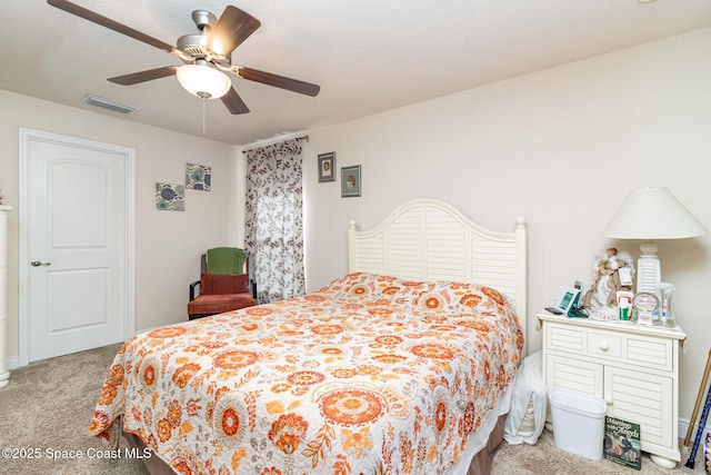 bedroom featuring ceiling fan and light colored carpet