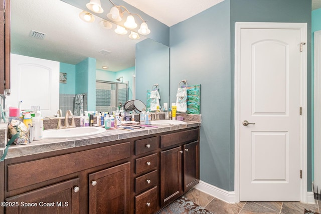 bathroom with vanity and an enclosed shower