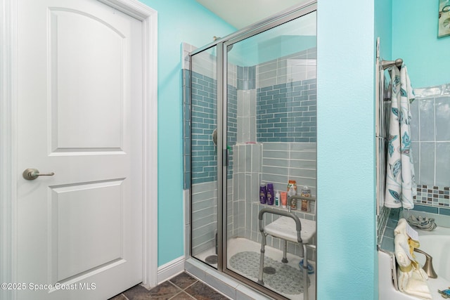 bathroom with tile patterned floors and a shower with shower door