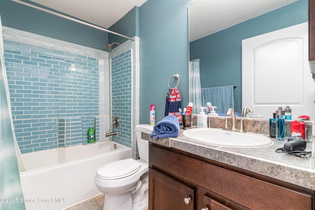 full bathroom with vanity, tile patterned flooring, toilet, shower / bath combo with shower curtain, and a textured ceiling