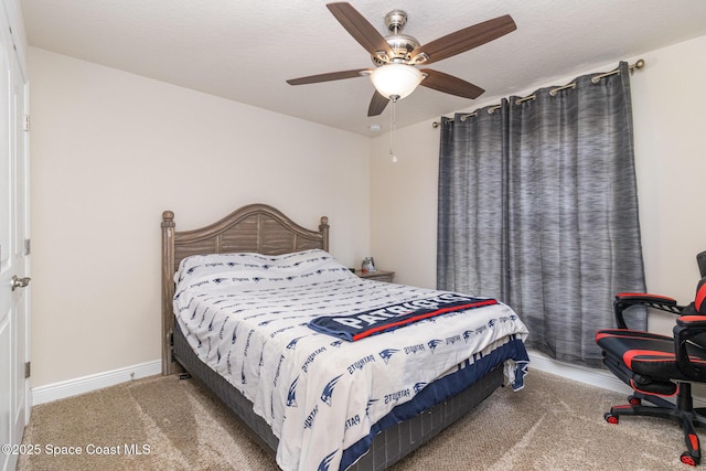 bedroom with ceiling fan and carpet floors