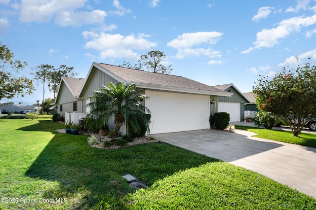 view of front of house with a front yard and a garage