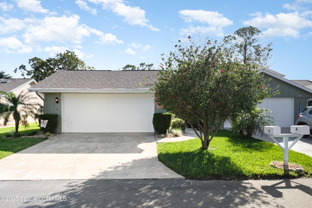 view of front of house with a front lawn and a garage