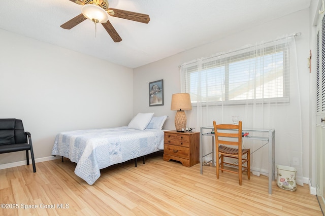 bedroom with wood-type flooring and ceiling fan