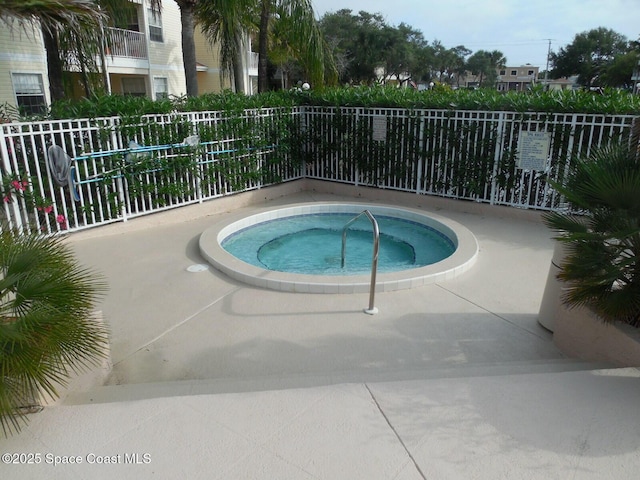 view of pool with a community hot tub