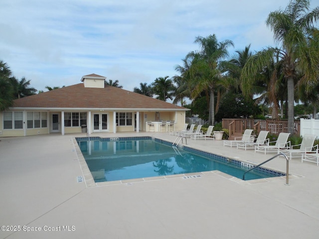 view of swimming pool with a patio