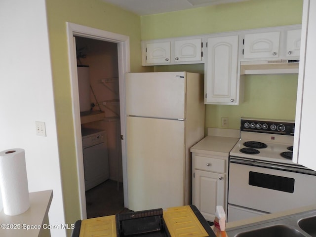 kitchen featuring white cabinetry, white appliances, and washer / clothes dryer