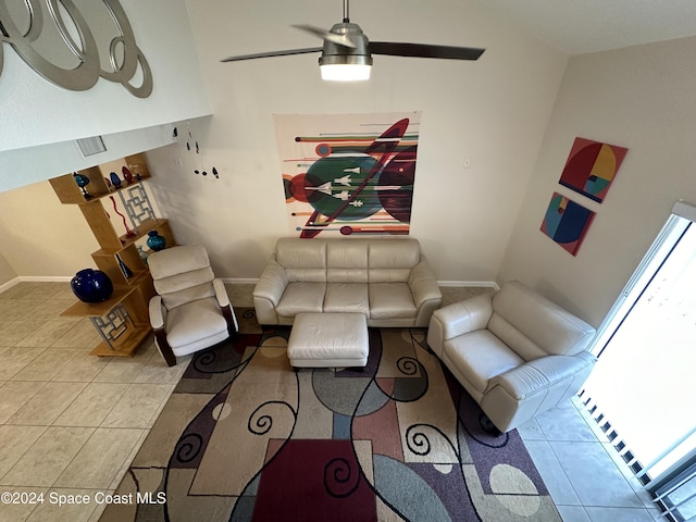 living room featuring ceiling fan and light tile patterned floors