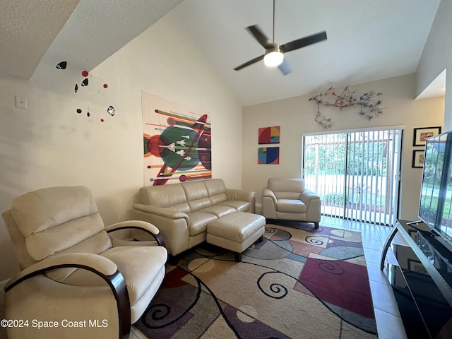 living room featuring ceiling fan and vaulted ceiling