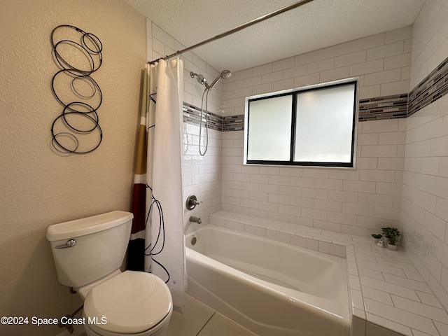 bathroom featuring toilet, tile patterned flooring, shower / bath combination with curtain, and a textured ceiling