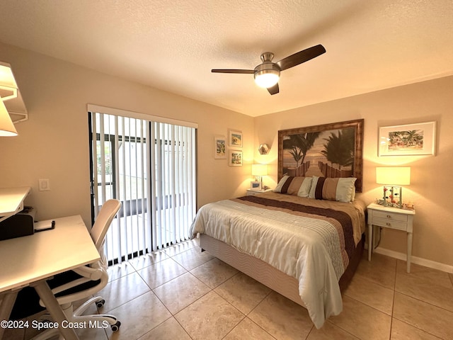 tiled bedroom featuring a textured ceiling, ceiling fan, and access to exterior