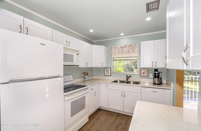 kitchen with light stone countertops, sink, dark wood-type flooring, white appliances, and white cabinets