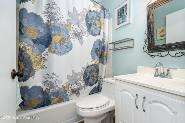 full bathroom featuring vanity, shower / bath combination with curtain, and toilet