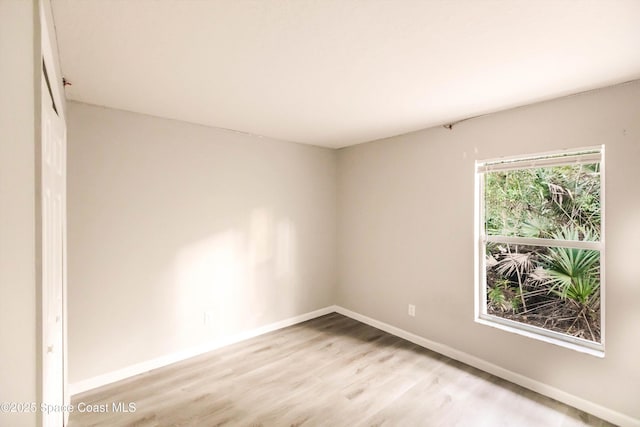 spare room with light hardwood / wood-style floors