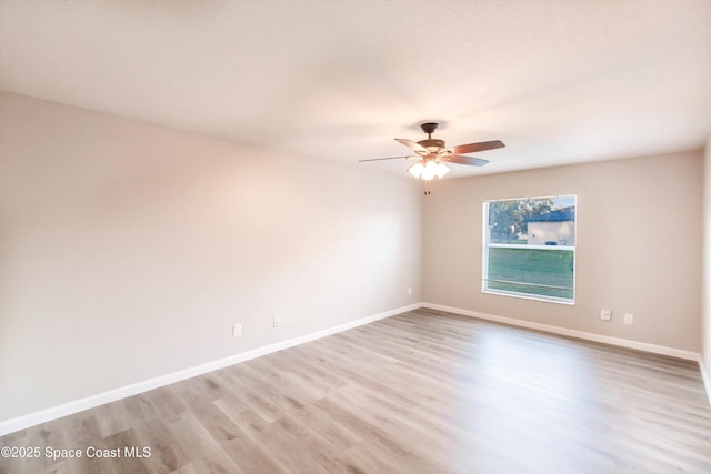 unfurnished room featuring ceiling fan and light wood-type flooring