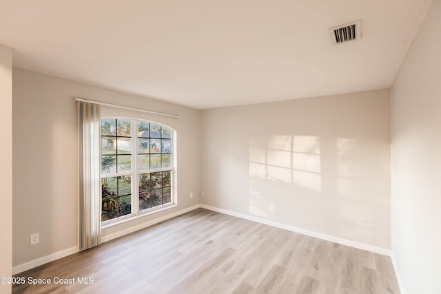 empty room with light hardwood / wood-style floors