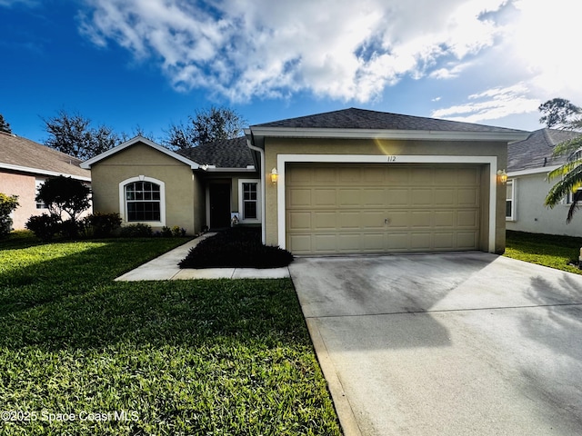 ranch-style house featuring a garage and a front yard