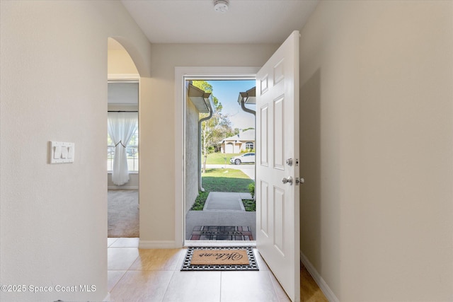 foyer entrance with light tile patterned floors