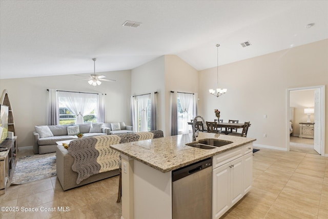 kitchen featuring white cabinetry, sink, stainless steel dishwasher, an island with sink, and vaulted ceiling