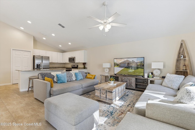 tiled living room with high vaulted ceiling and ceiling fan