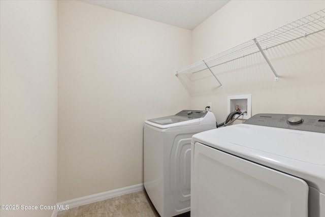 laundry area with separate washer and dryer