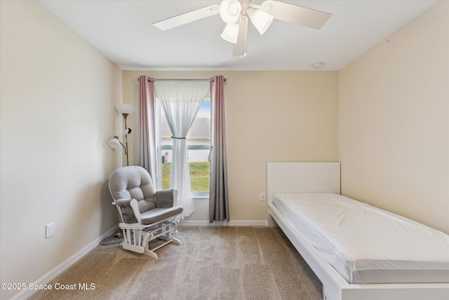 bedroom with ceiling fan and carpet floors